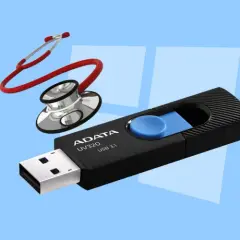 Pendrive ADATA UV320 USB 3.1 i stetoskop na jasnoniebieskim tle.